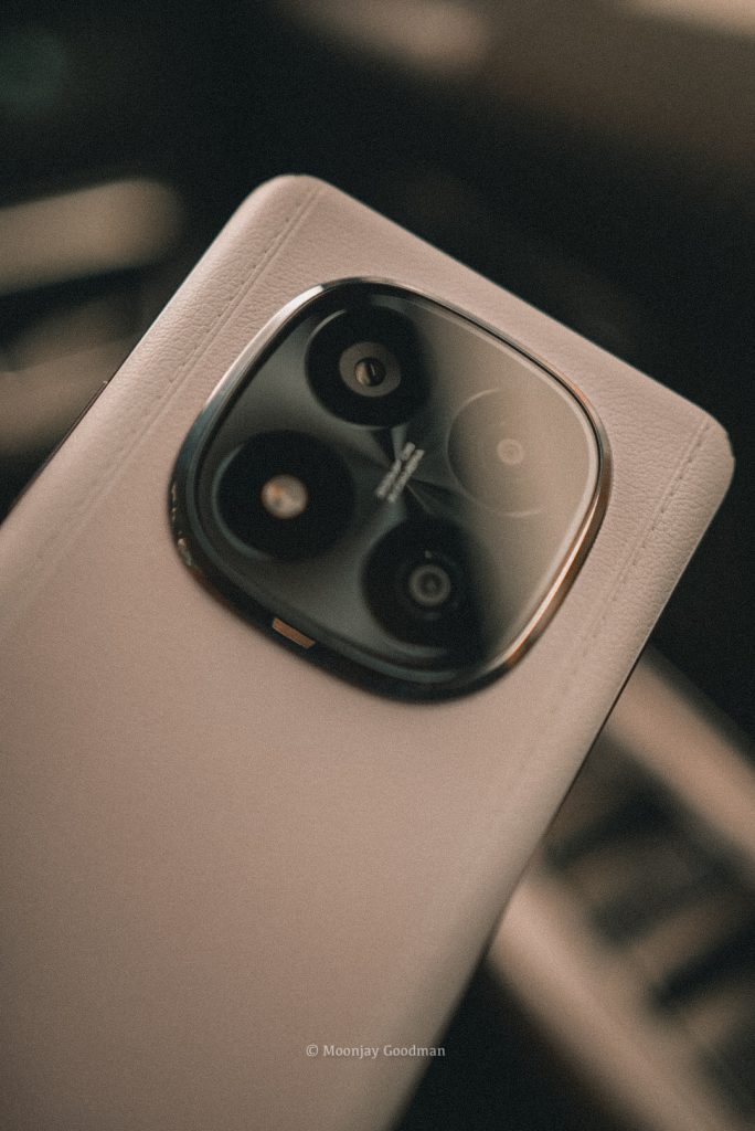 Close-up of the Redmi Note 14 Pro+ triple rear camera with metal ring