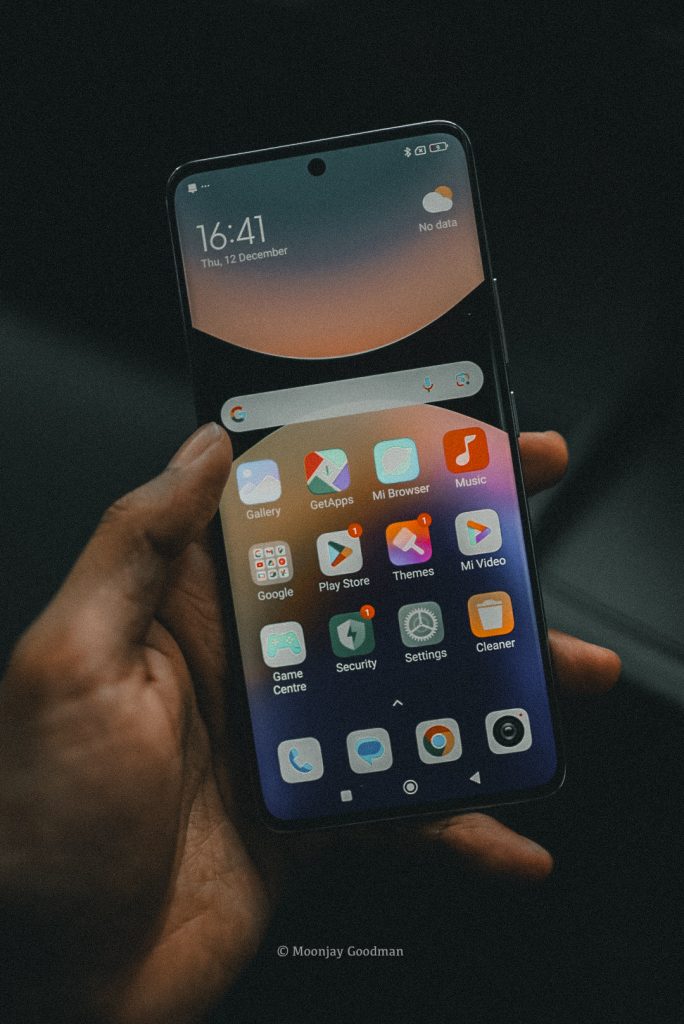 Redmi Note 14 Pro+ home screen with app icons, held in hand